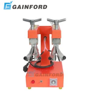 Front view of Gainford electric heating double head shoe stretcher machine with aluminum lasts and orange base.